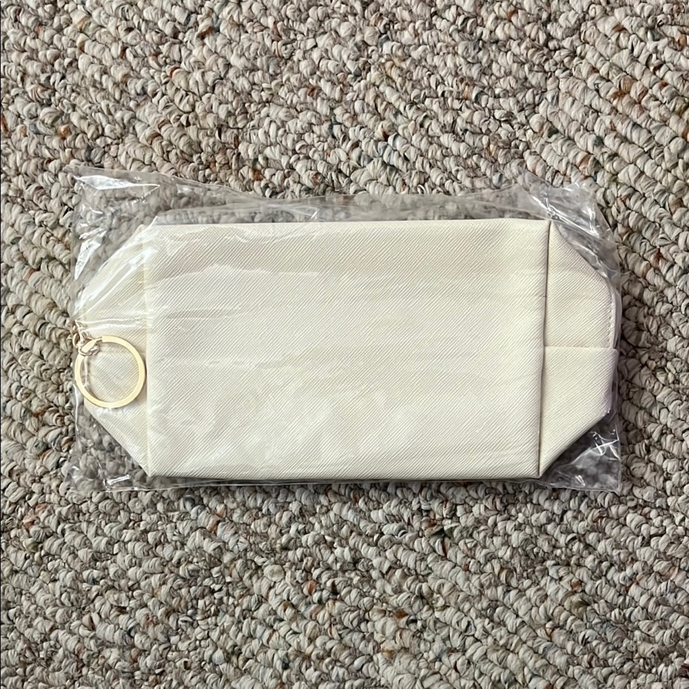 Elegant Cream Pouch with Gold Ring
